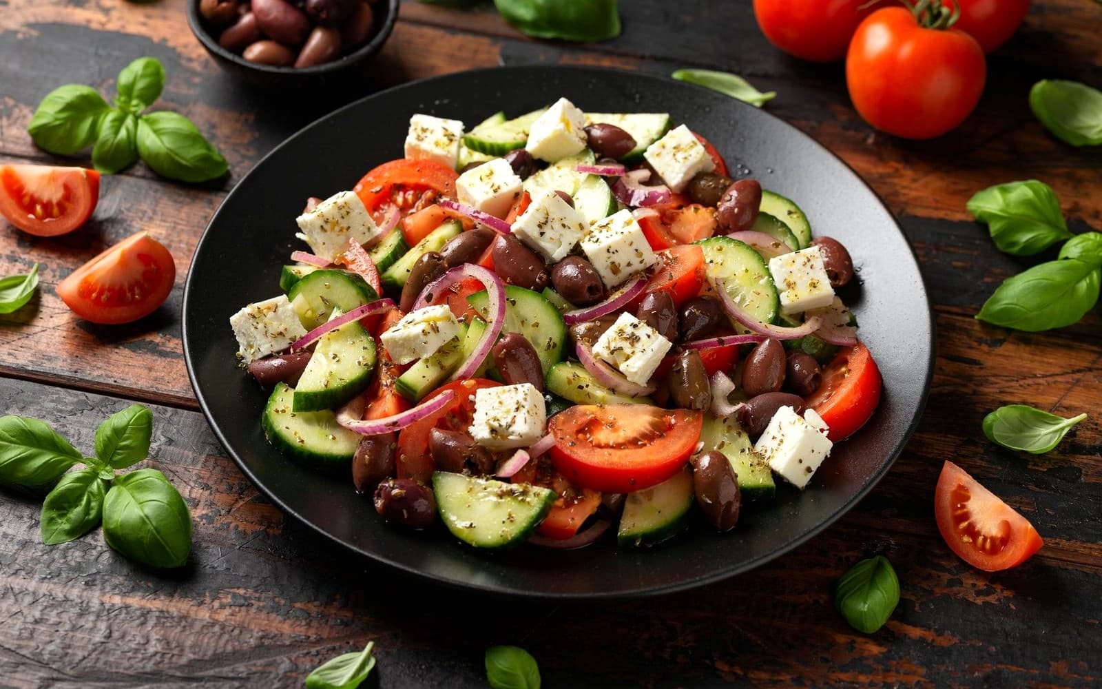 Greek salad with feta, olives, cucumber, tomato, and red onion