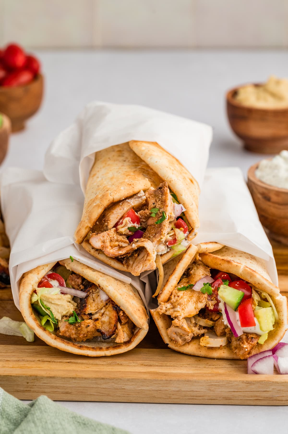 Chicken gyro wraps served on a wooden board