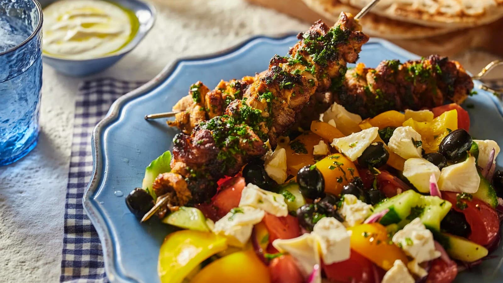 Mediterranean mezze spread with dips, pita, olives, vegetables, and breads